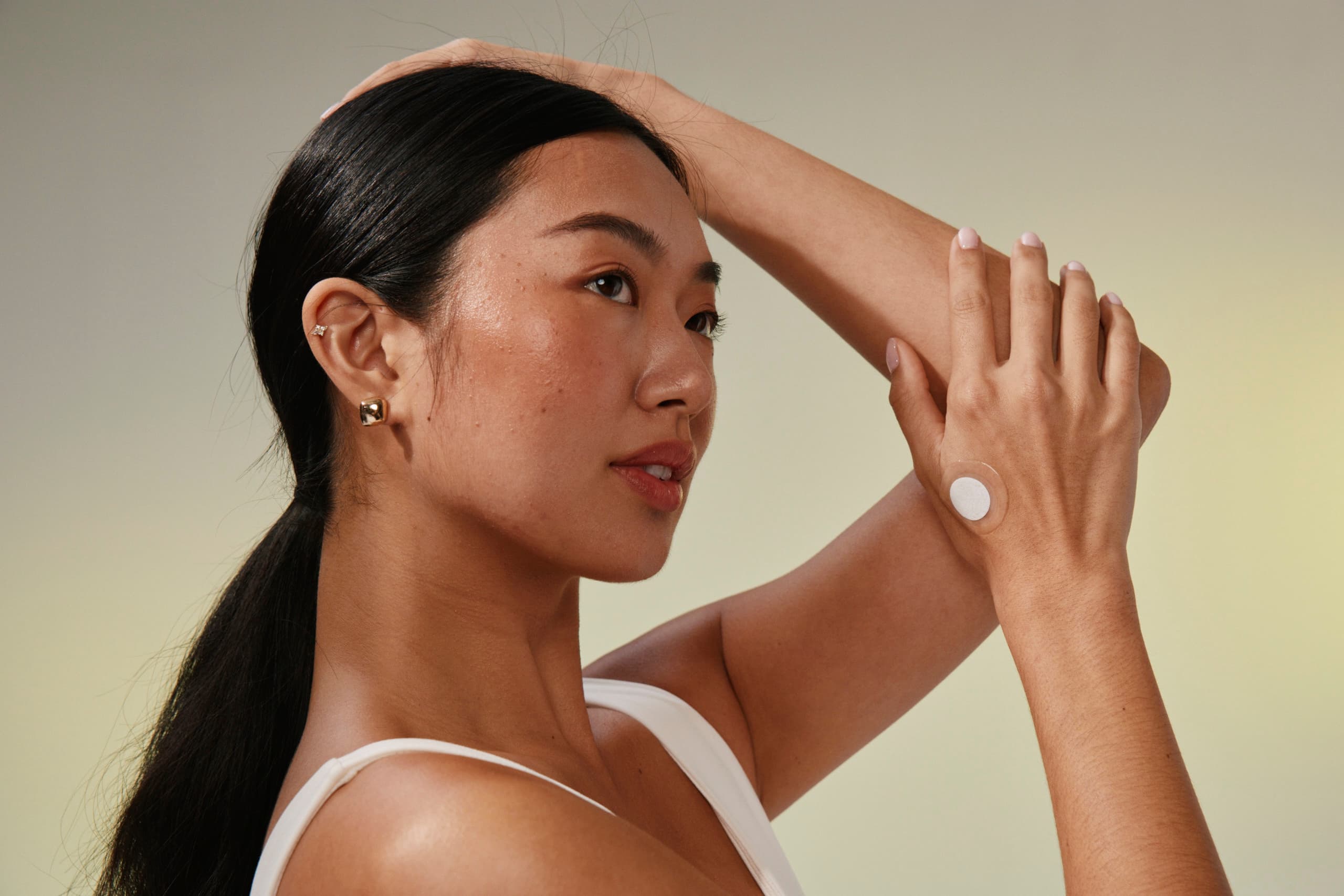 Clinical study participant applying patch